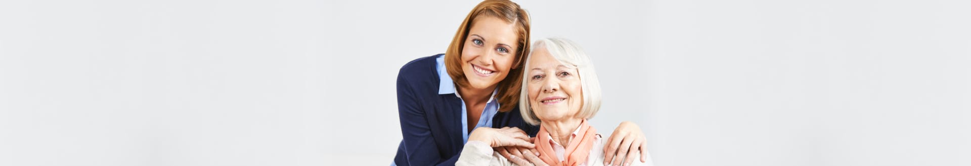 portrait of senior woman and caregiver